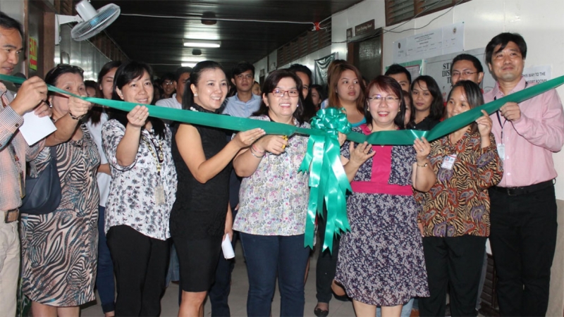Assistant Vice Chancellor for Academic Affairs Julieta A. Delos Reyes cuts the ribbon to officially begin the three-day job fair for students and alumni. With her are CTD Head Ms. Janett A. Dolor and OSA Director Nina M. Cadiz.